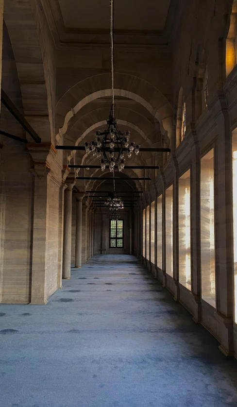 an archway lined with glass windows is shown