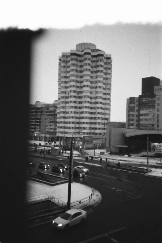 a very large building with some big buildings in the background