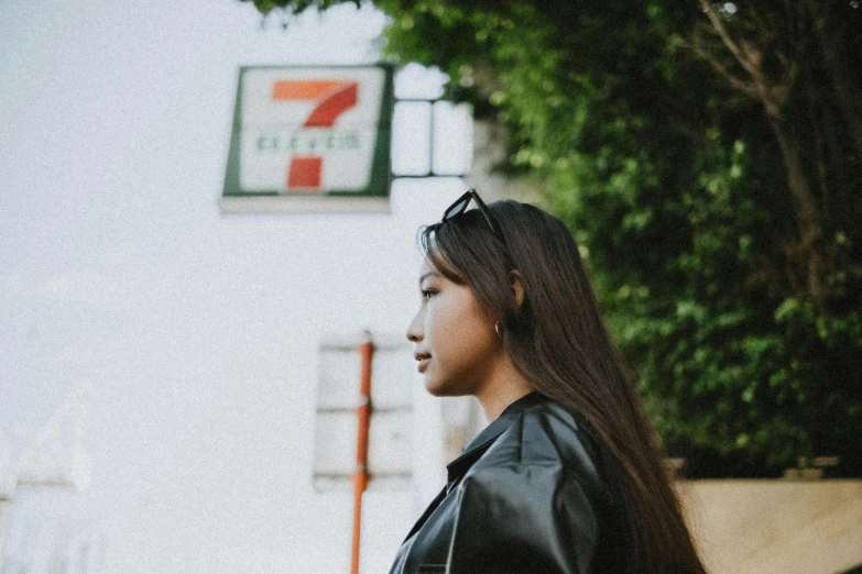 a woman in leather clothes outside a store