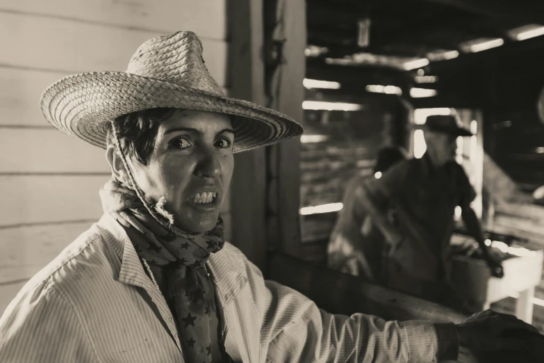 black and white image of man in hat at market