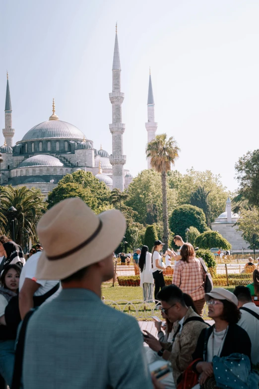 people are sitting outside near the blue mosque