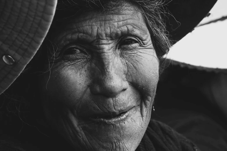 an older woman is looking at the camera