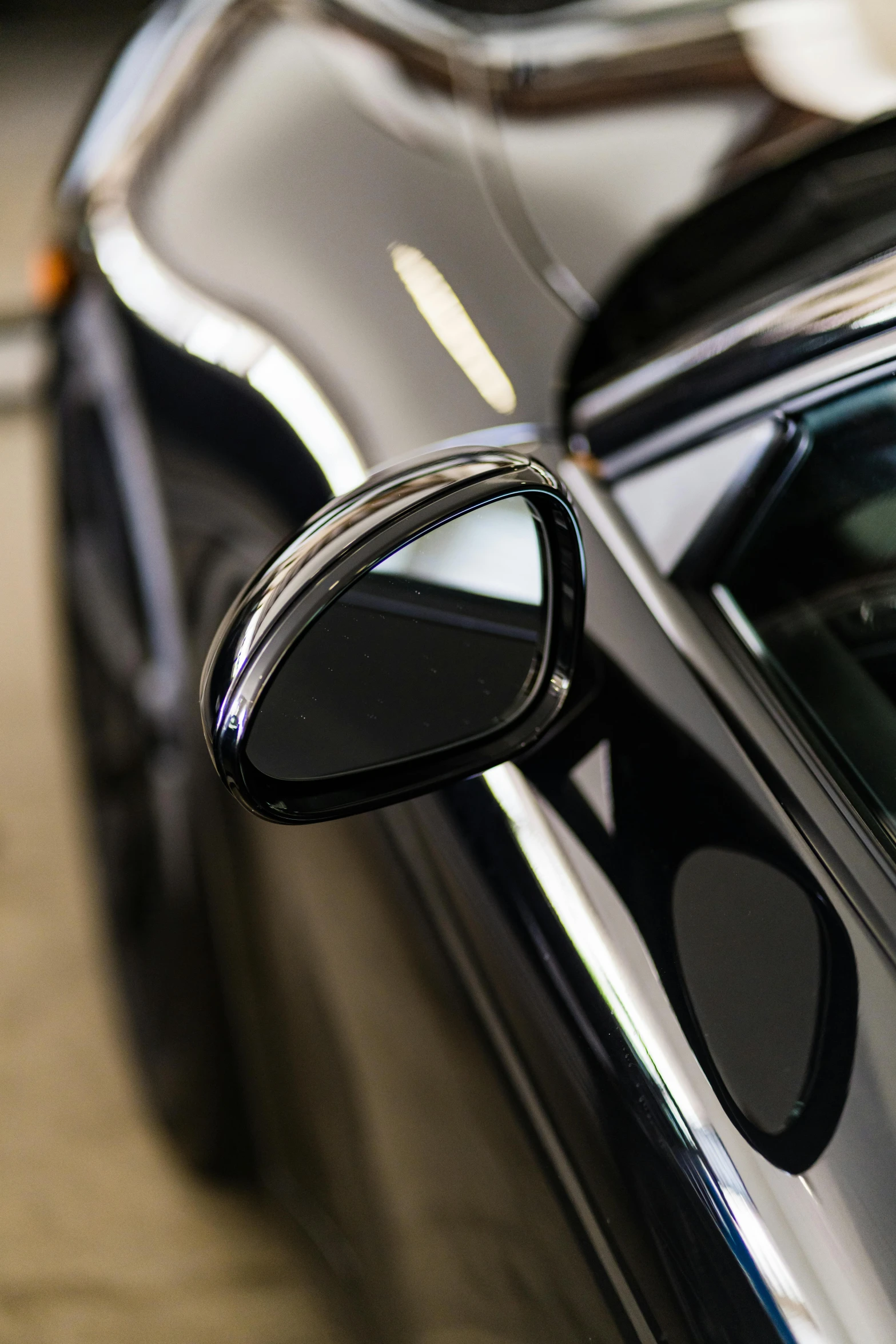 the inside of a black car with its door open