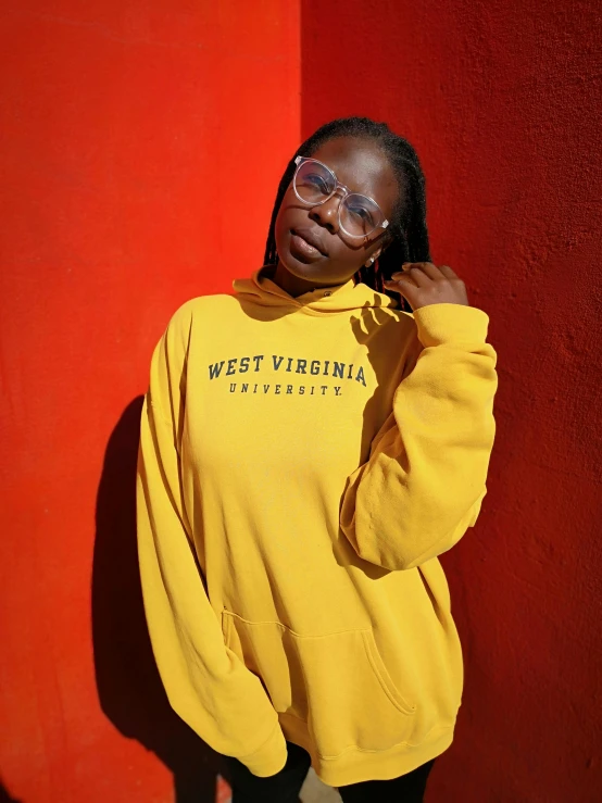 a woman with glasses on a red background