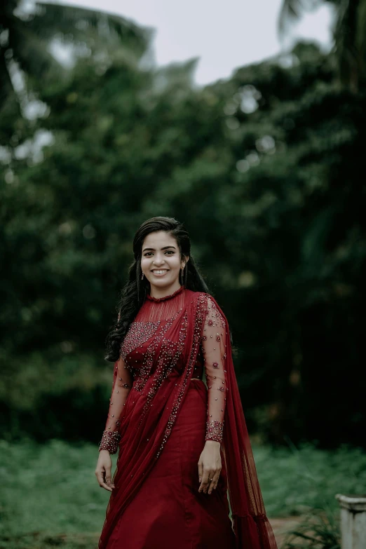 a woman in a long dress is walking down the path