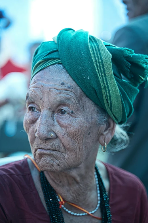 an older woman with a turban on her head