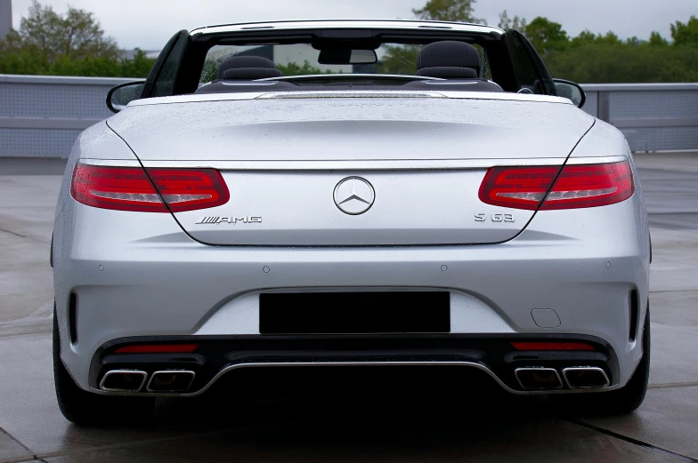 the rear end of a white mercedes benz cla