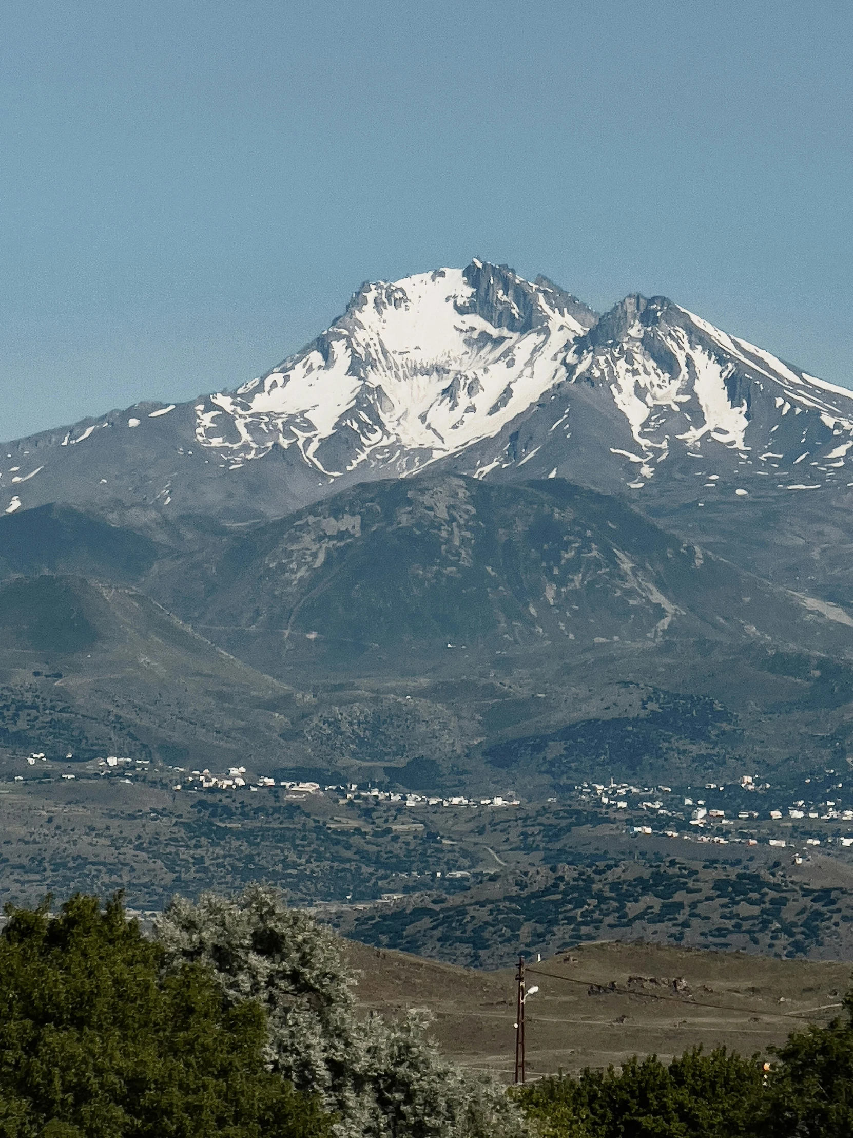 an image of the mountains that surround a town