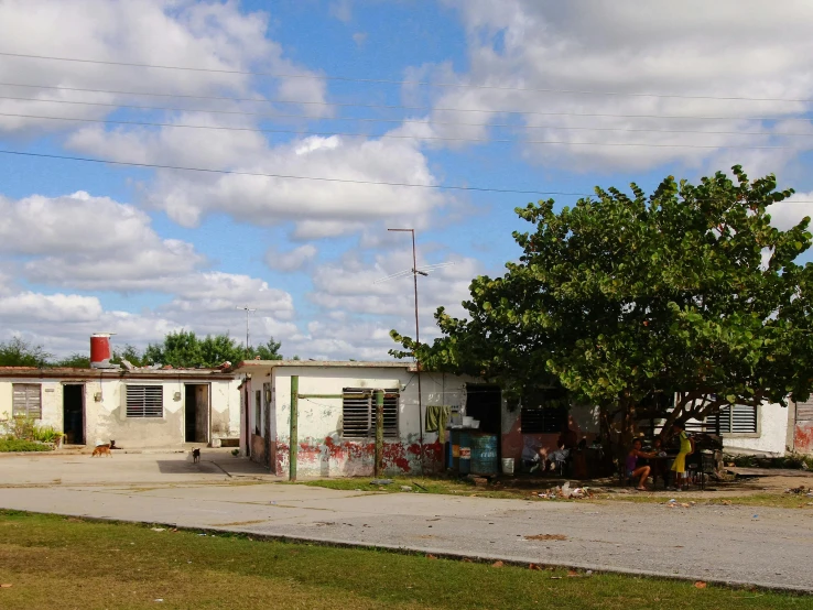 an old white building with graffiti on it