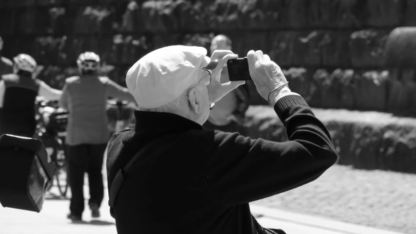 black and white pograph of a woman taking a po