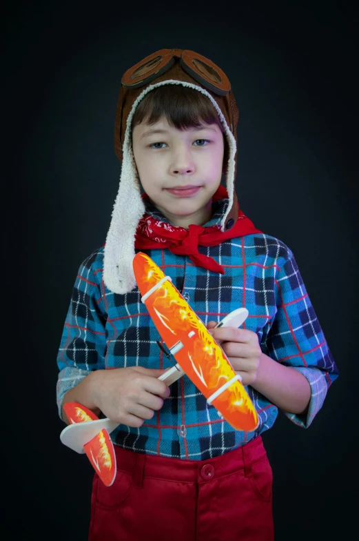 this is an image of a boy holding a toothbrush