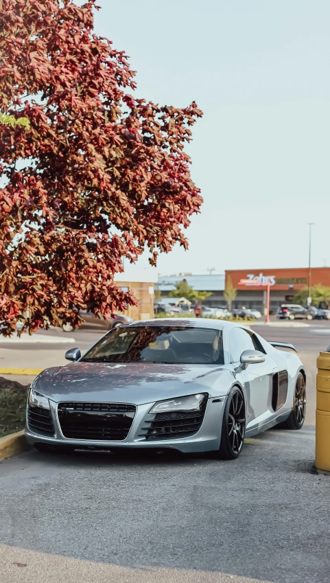 a grey car parked on the side of a road