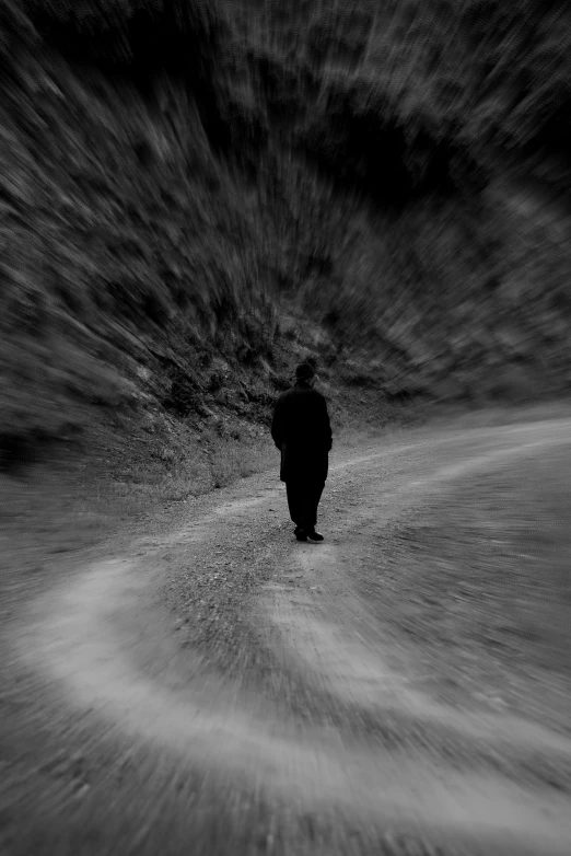 a black and white po of a person walking