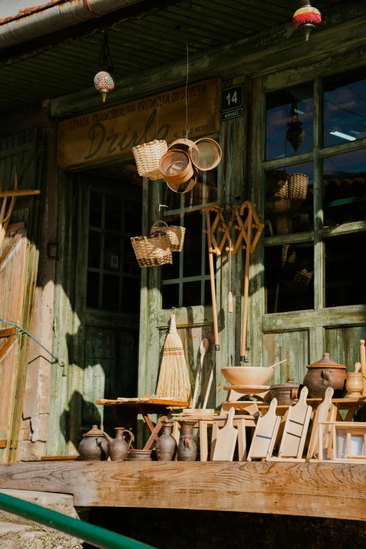 there is a lot of items on the wooden table outside