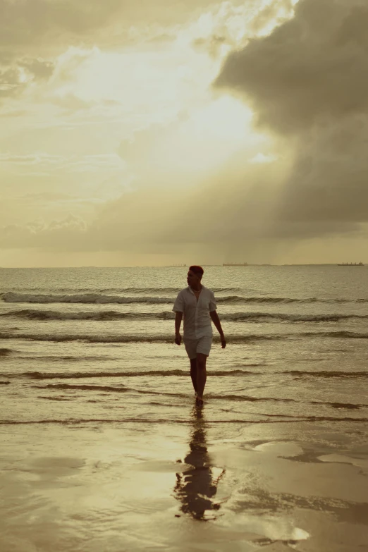 the person standing alone in front of the ocean