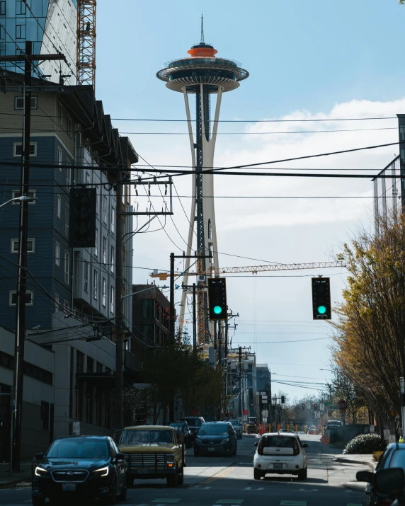 cars are driving on a quiet city street