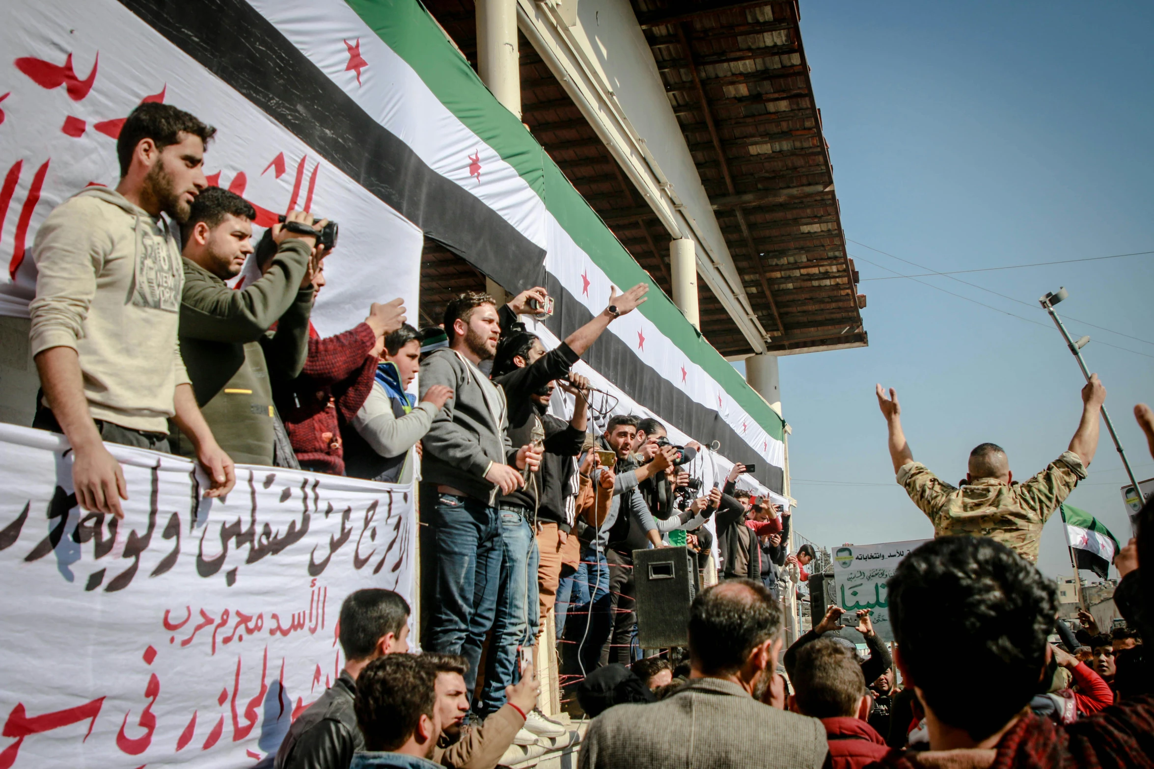 a group of people holding a banner outside