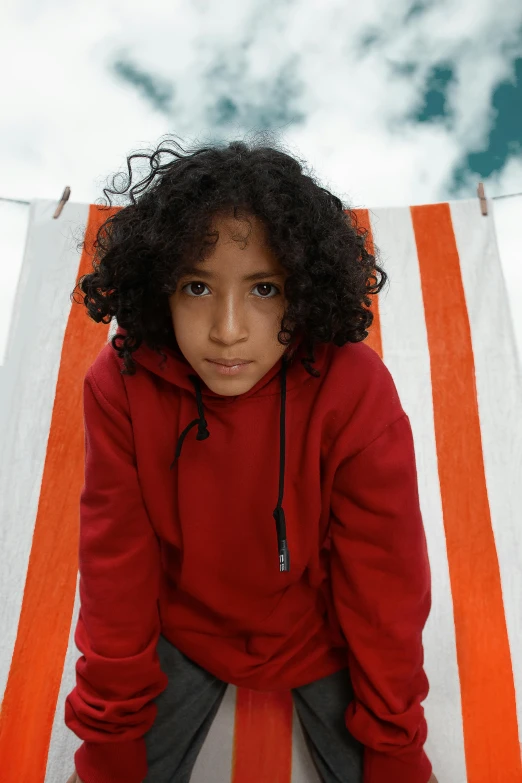 an adorable small girl with an orange and white towel