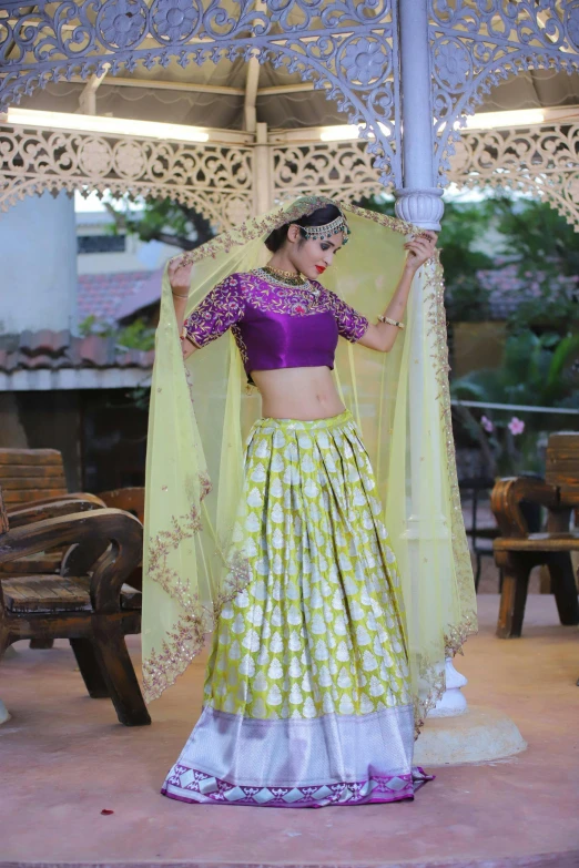 a woman in an indian sari dancing