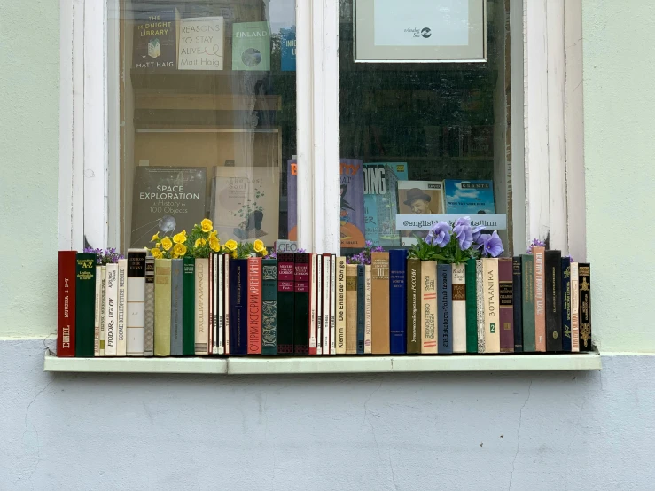 a shelf that has some books on top of it