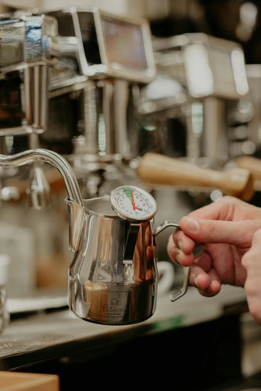 someone is filling up a coffee maker with coffee