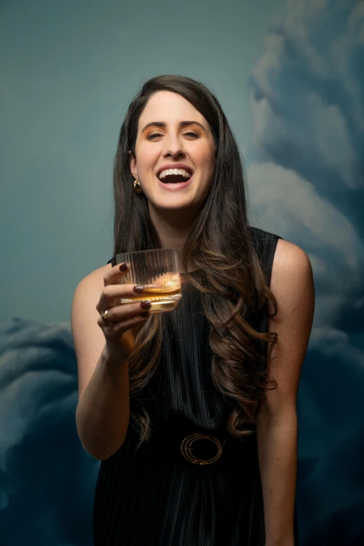 an image of a woman smiling with wine