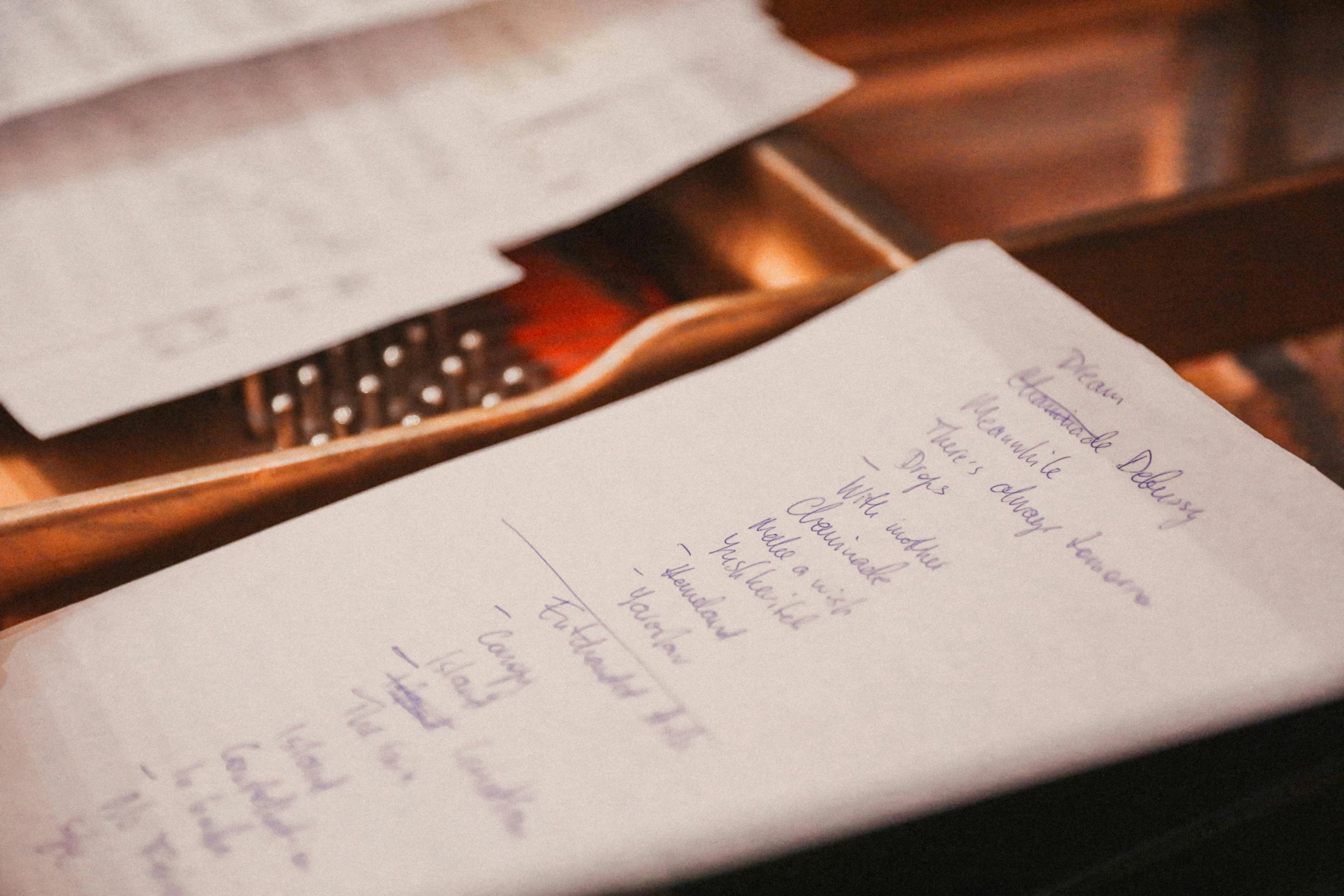 an old book with writing on it sitting on a table