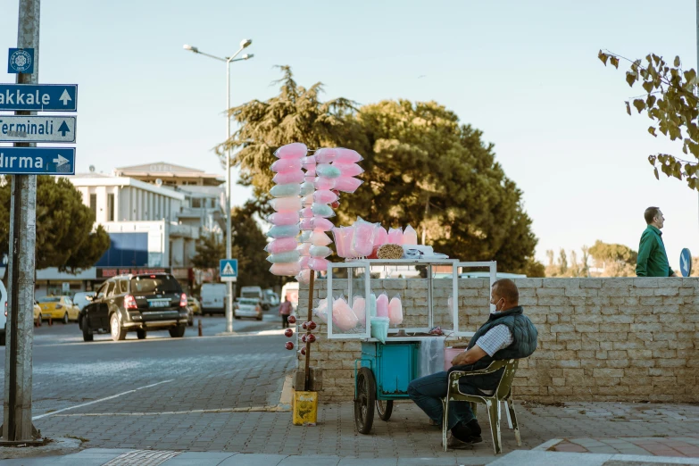 a man in his car, looking at the street