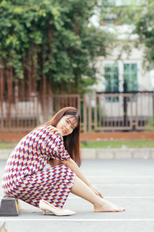 a woman is kneeling down with her hand on her knee