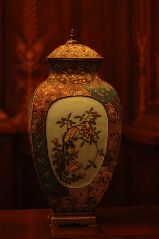 this urn is decorated with a decorative painting