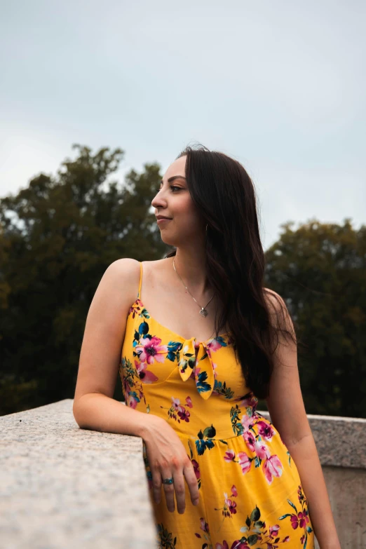 an image of a woman standing outdoors smiling