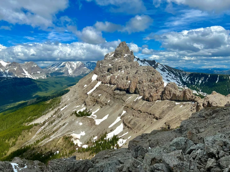 a high mountain has snow on the top