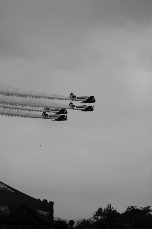 airplanes flying through the sky doing tricks