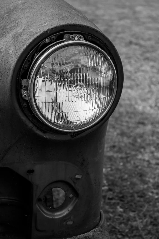 the headlight of an old motorcycle, close - up