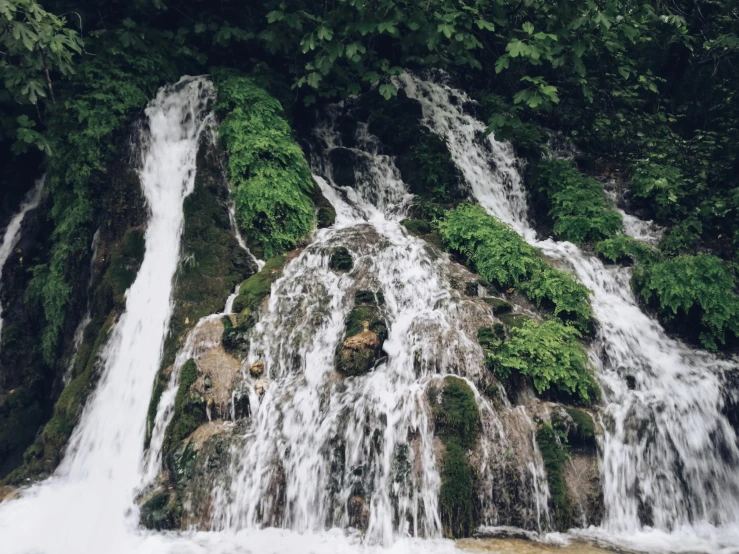 a waterfall has small water casings