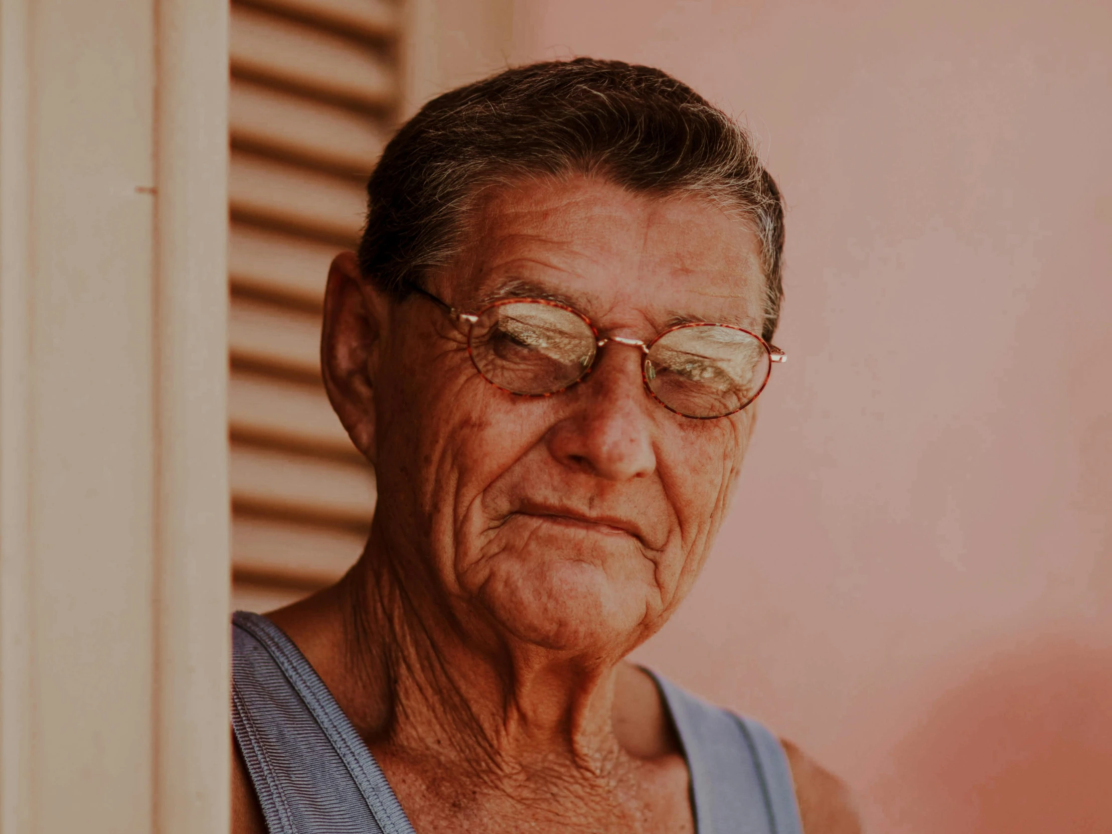 a woman with a vest is looking towards the left