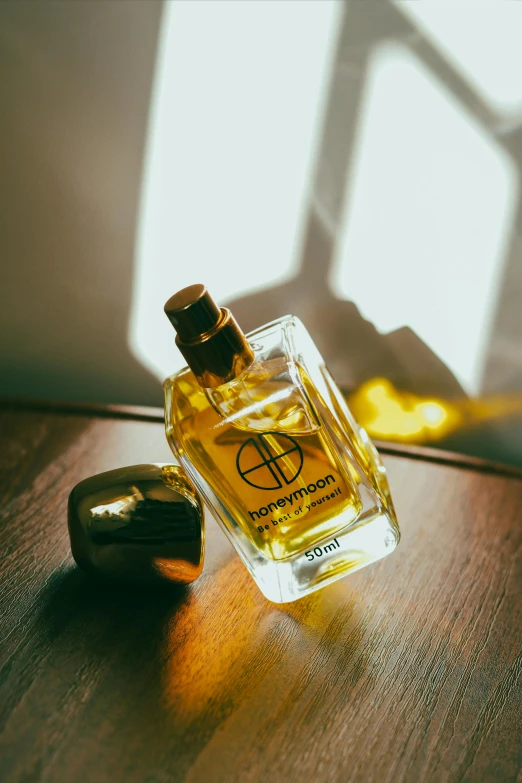 an image of a bottle of perfume with the reflection of a wall in the back