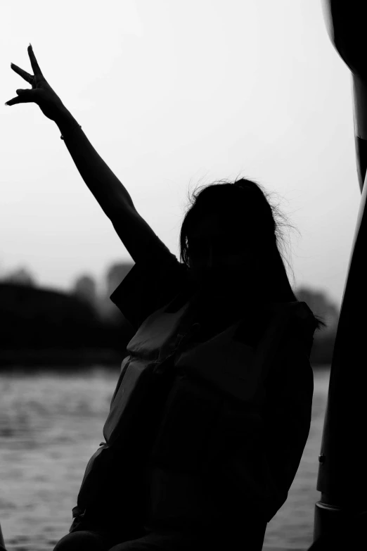 a black and white po of a person throwing a frisbee