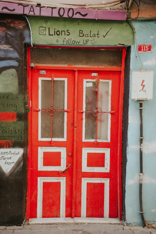 an orange door on the side of a building