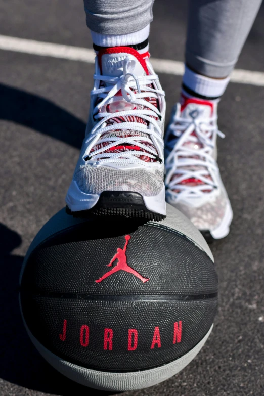 a basketball with jordan shoes on is displayed