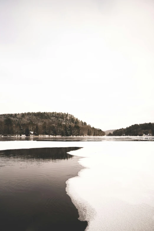 a picture taken in the snow showing a small island in the distance