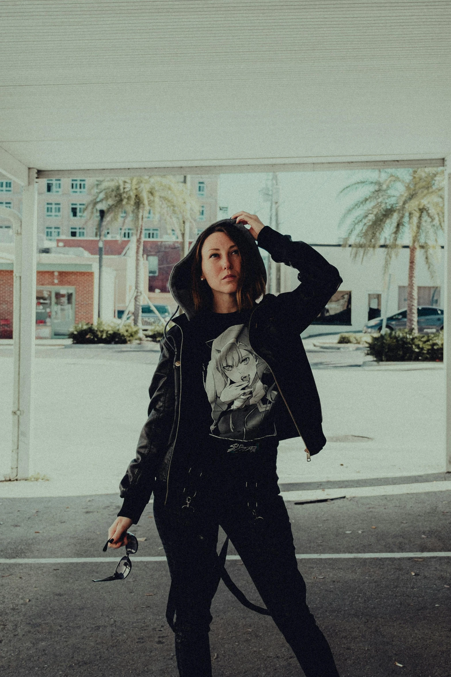 a woman is walking in the open street