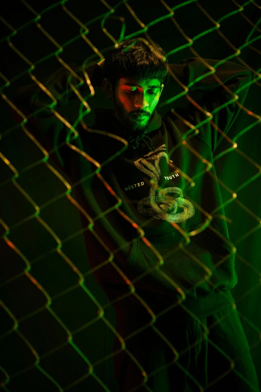 a man in green is standing near some green lights