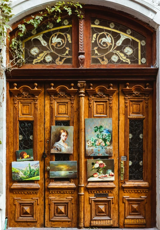 the front door is wood and has ornate art on it