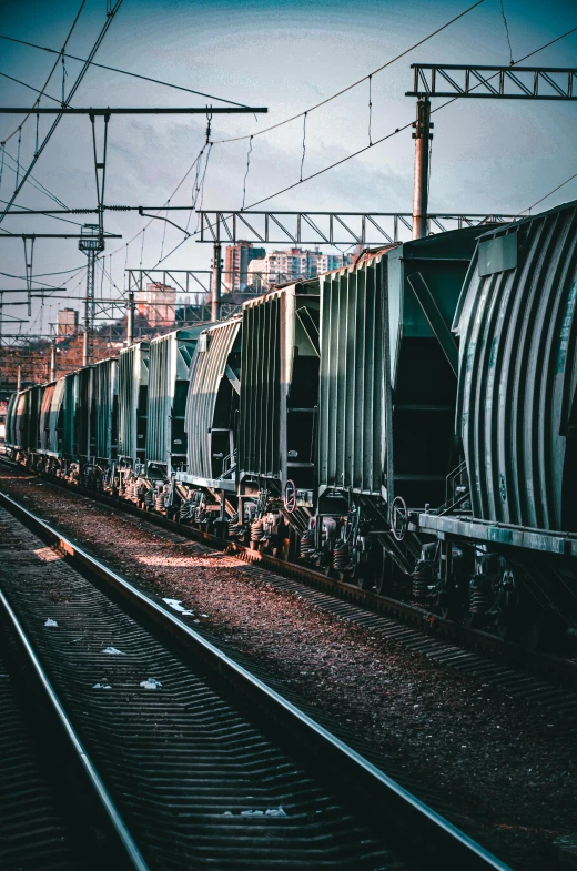 an empty train car traveling down tracks under wires