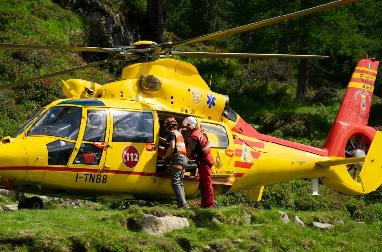 a man getting his helicopter ready to take off