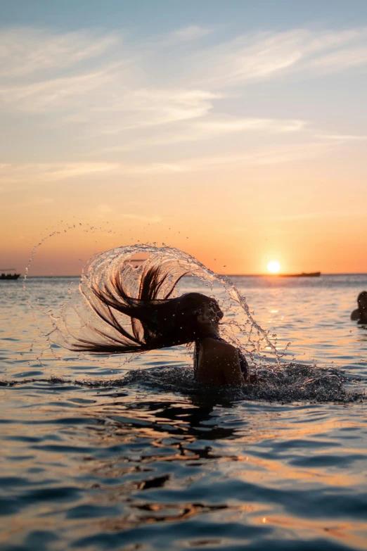 a person in the water with a net on their head