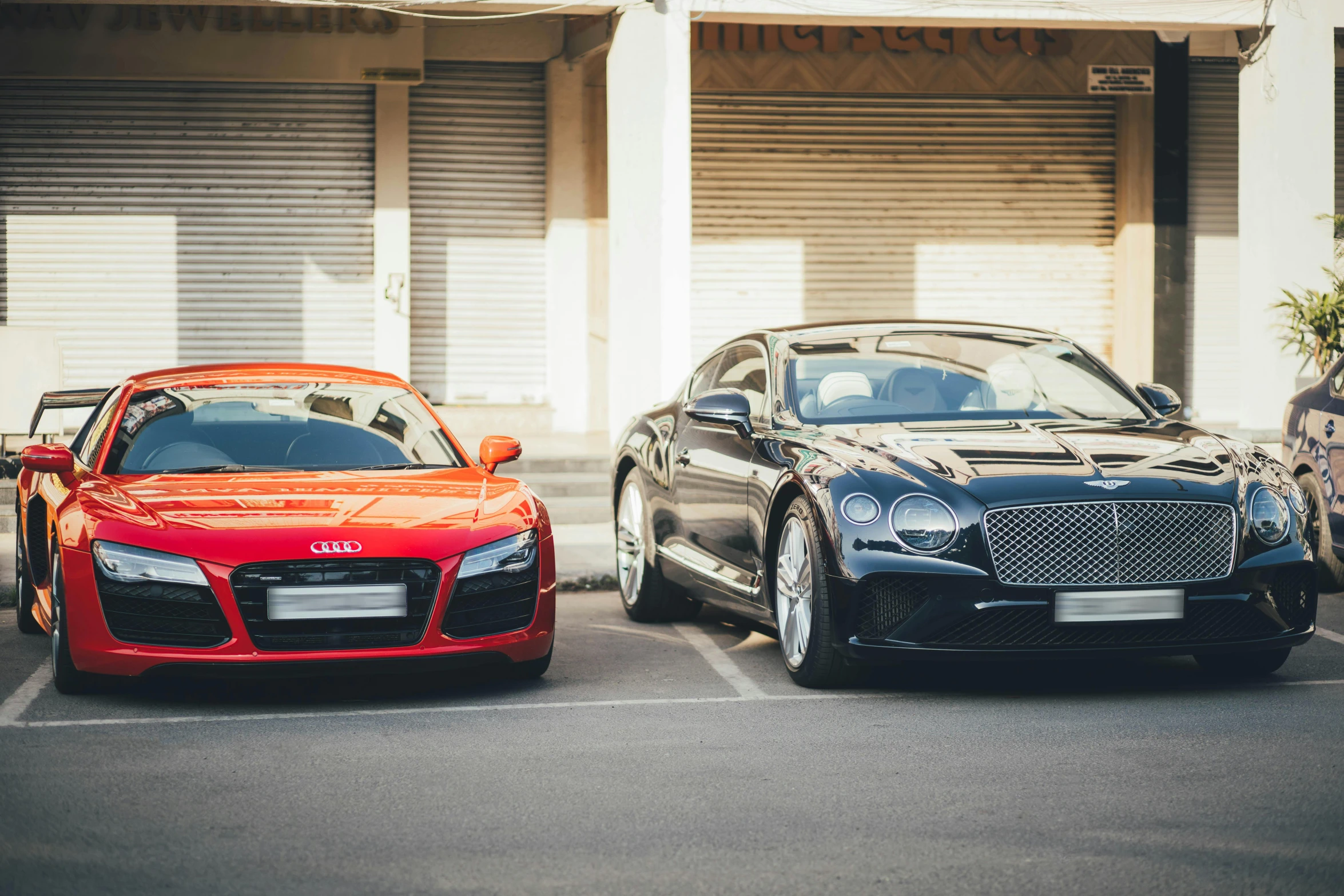 a couple of cars parked in a parking lot