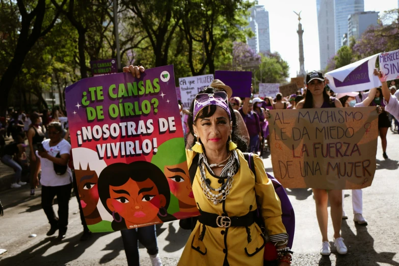 there are people with banners marching in a protest