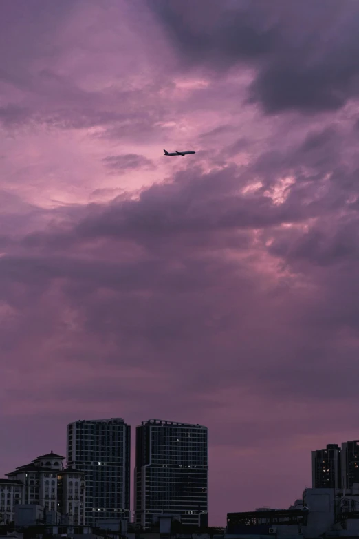 a jet plane flying high up into the sky